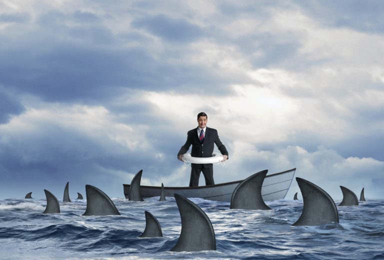 Stranded Businessman Surrounded By Sharks in Dinghy